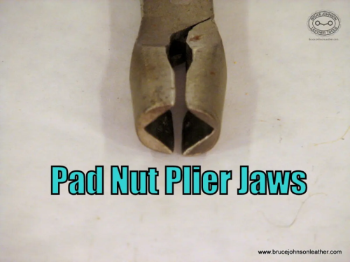 Close-up of the square jaw tips of pad nut pliers.